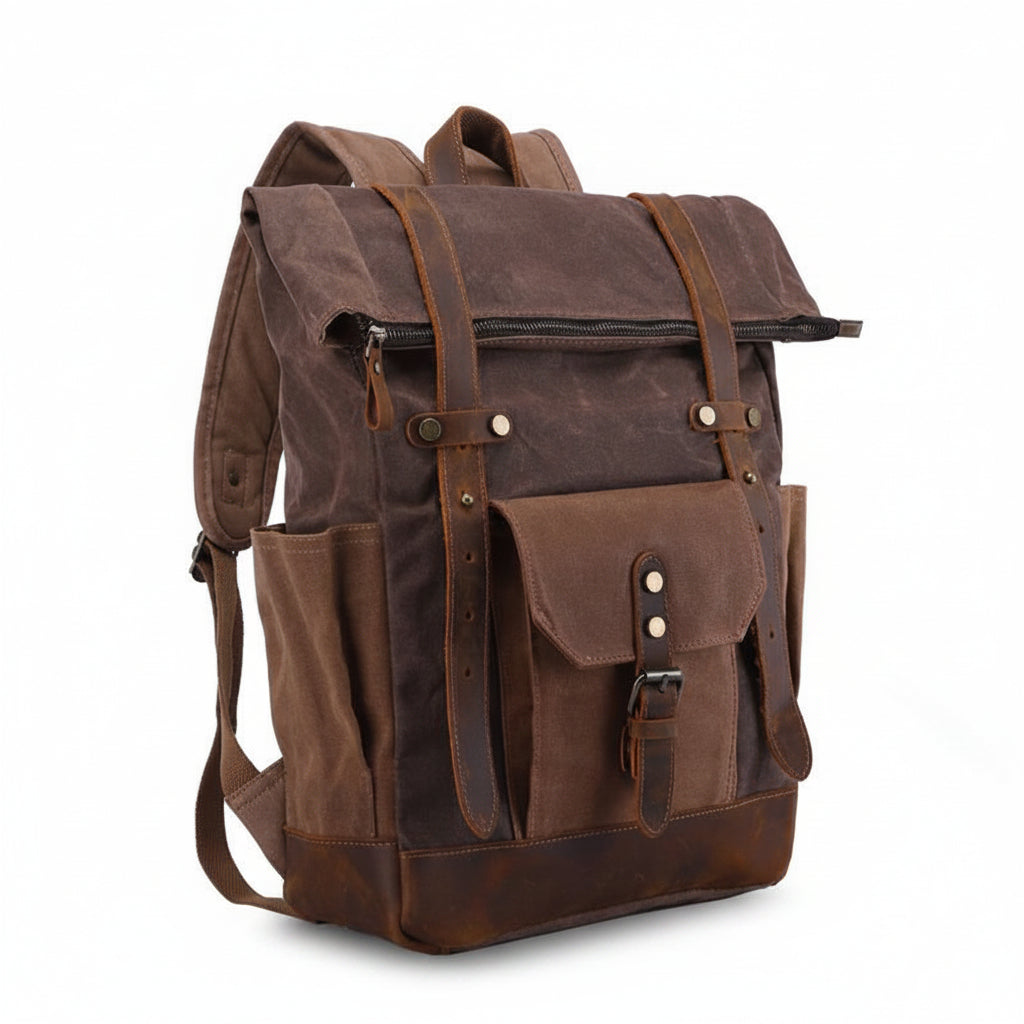 Waxed canvas rucksack showing buckled flap closure and front strap pocket