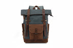 Riveted leather grab handle detail on waxed canvas backpack