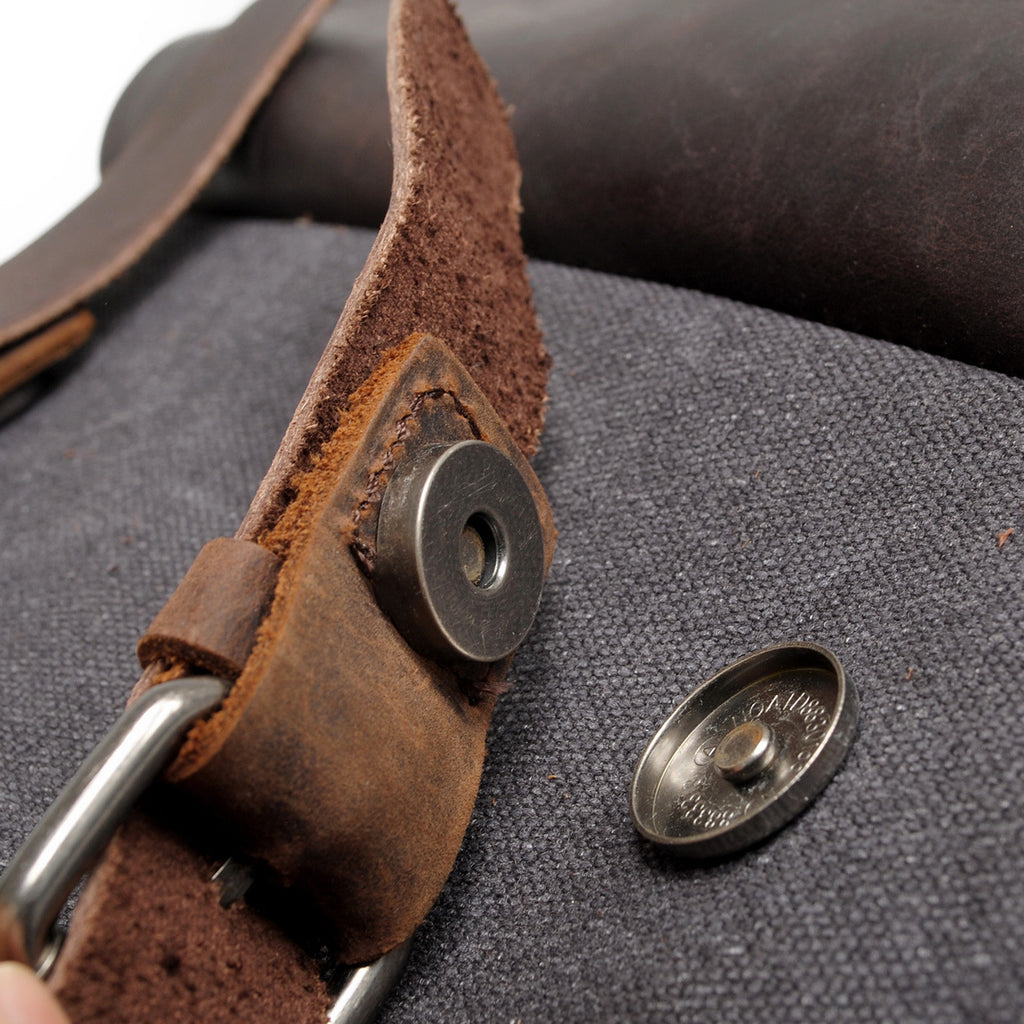 Khaki canvas backpack with contrasting crazy horse leather base