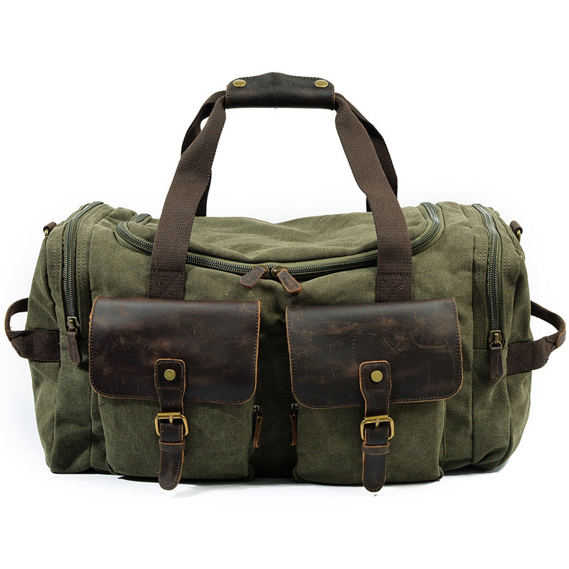 Canvas overnight bag carried by hand, showing scale