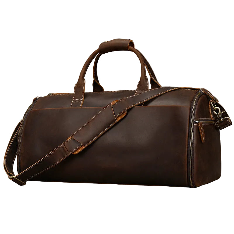 Brown leather duffel bag on a gray background
