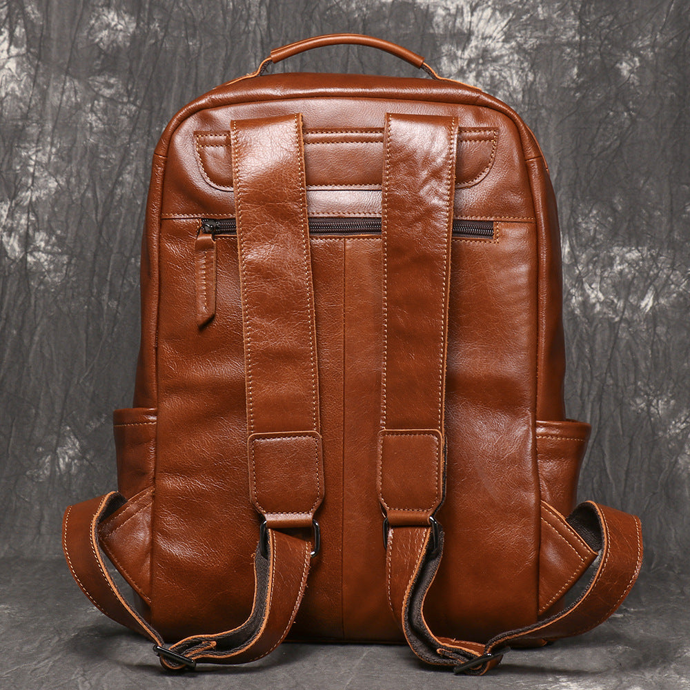 Rear view of cowhide rucksack with adjustable straps and back panel pocket