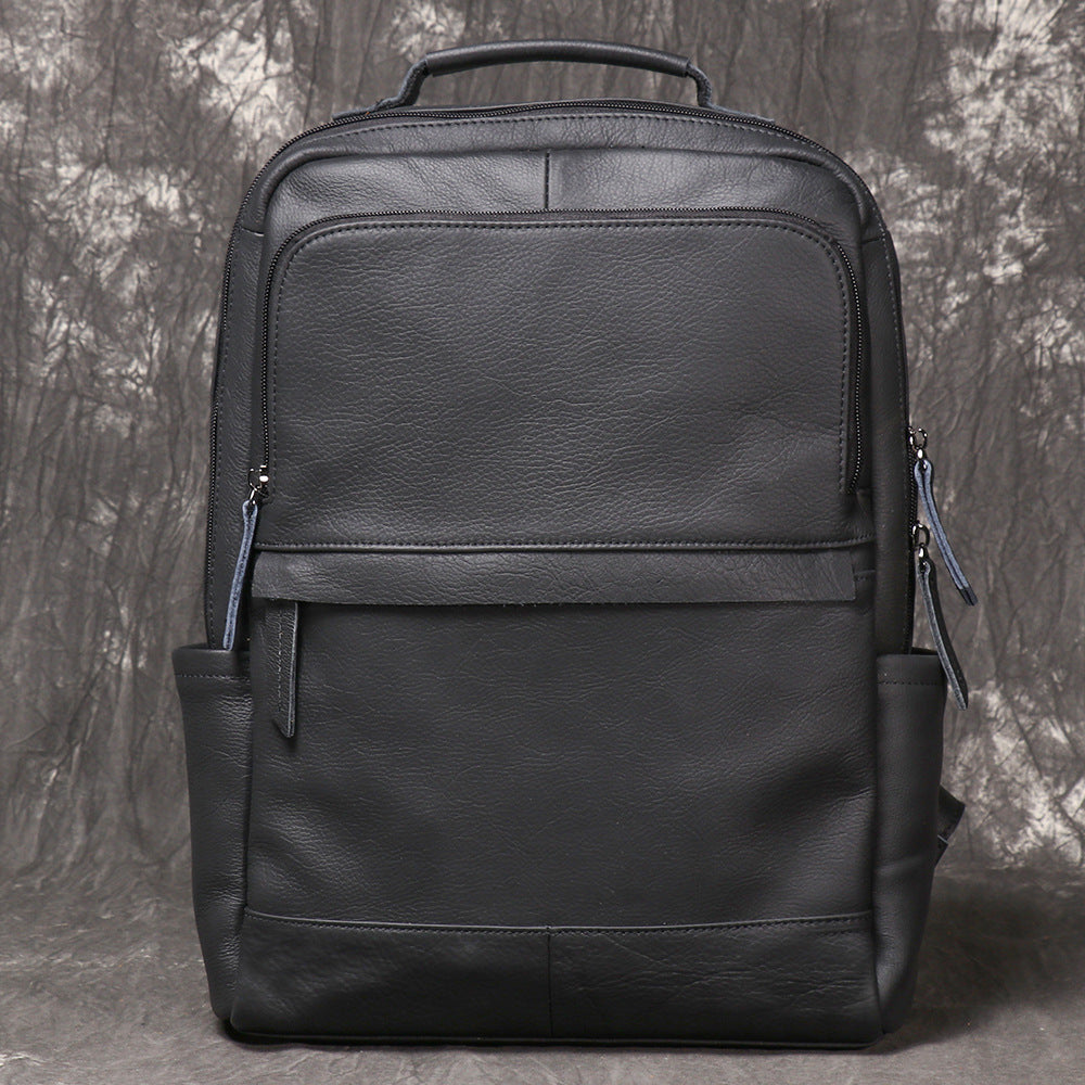Interior of leather backpack showing padded laptop sleeve and slip pockets