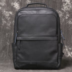 Interior of leather backpack showing padded laptop sleeve and slip pockets