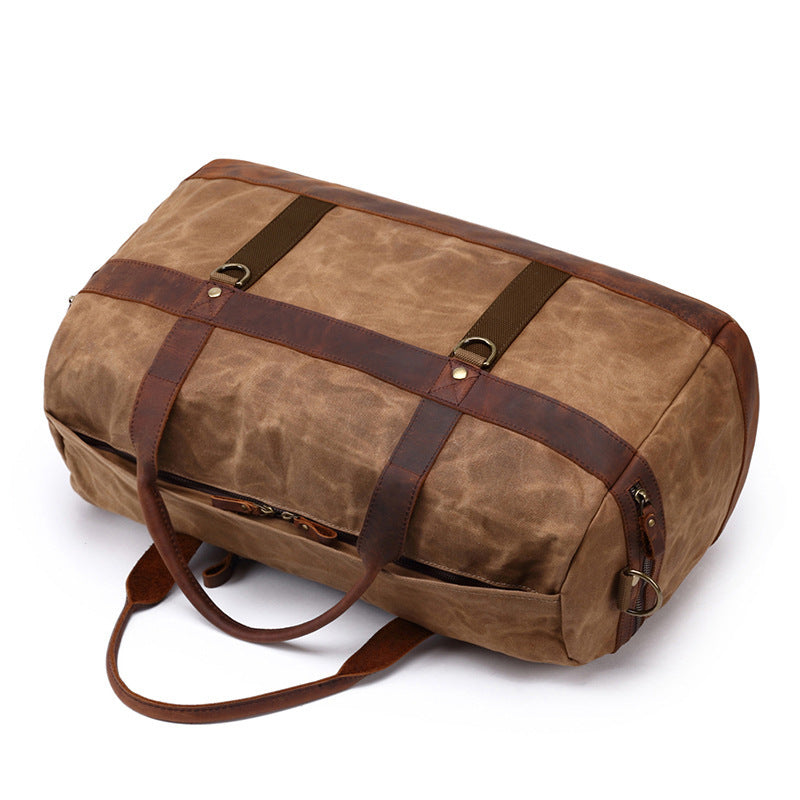 Grey canvas duffel bag, three-quarter view