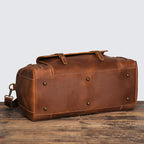 Dark brown crazy horse leather travel duffle, three-quarter view