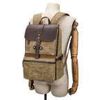 Batik canvas daypack showing zipped front pocket and leather base