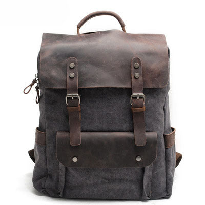Dark grey cotton canvas college backpack with crazy horse leather trim, front view