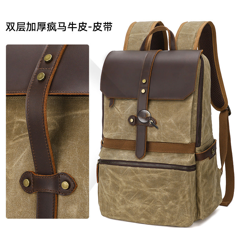 Dark grey waxed canvas backpack with antique brass hardware