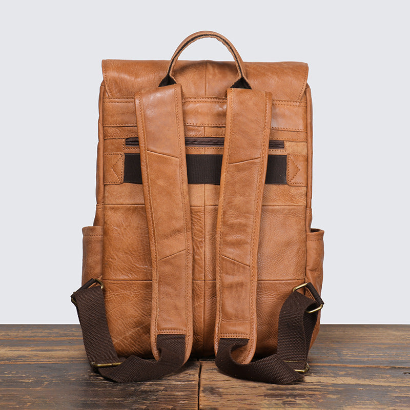 Rear view of leather backpack with adjustable shoulder straps and concealed zip pocket
