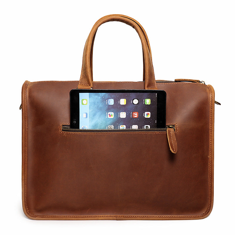 Interior of leather briefcase showing padded laptop compartment and document sections