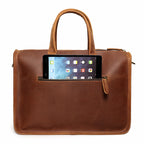 Interior of leather briefcase showing padded laptop compartment and document sections