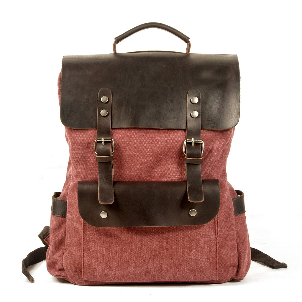 Crazy horse leather strap and buckle detail on canvas rucksack