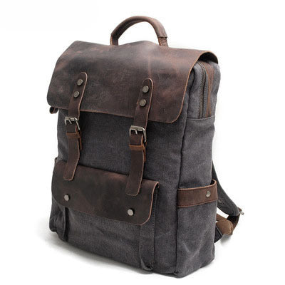 Canvas rucksack showing front flap pocket and leather straps
