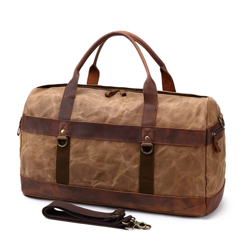 Canvas gym duffel showing full-length top zip and leather-bound handles