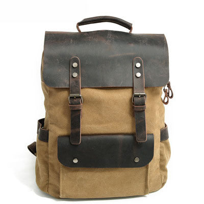 Khaki cotton canvas backpack with crazy horse leather trim and brass-tone hardware