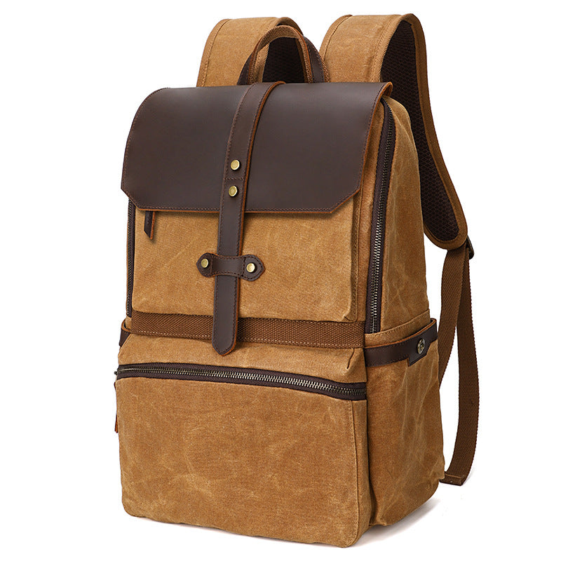 Crazy horse cowhide strap and buckle detail on canvas rucksack