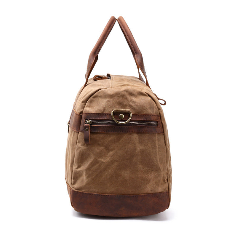 Khaki canvas travel duffel with adjustable shoulder strap