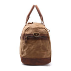 Khaki canvas travel duffel with adjustable shoulder strap