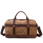 Army green canvas duffel bag with crazy horse leather trim, side view