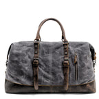 Black oil-wax canvas carryall, three-quarter view