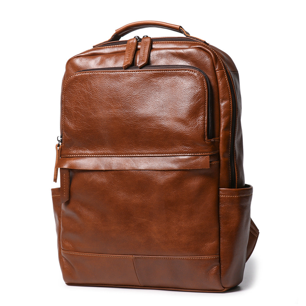 Meridian Leather Travel Backpack in brown cowhide, three-quarter view — Khal Gold