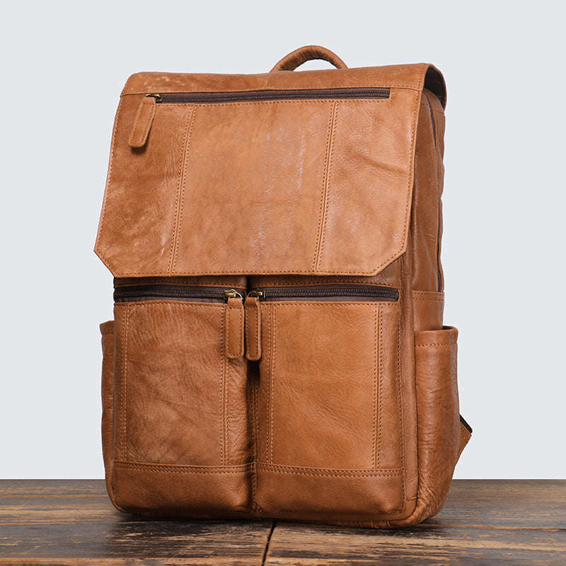 Leather rucksack showing the full-length zip opening
