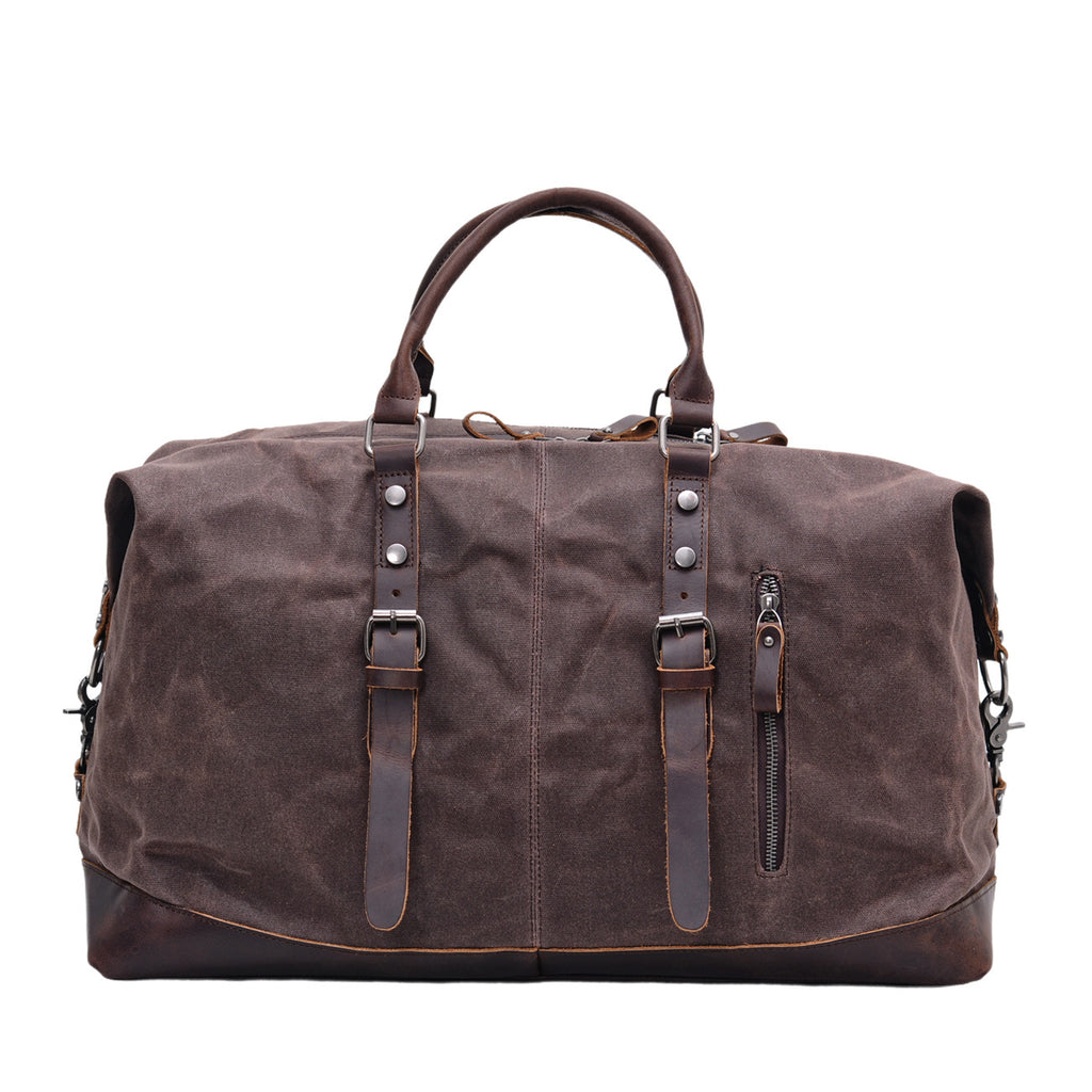 Green waxed canvas travel bag with cowhide base corners