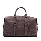 Green waxed canvas travel bag with cowhide base corners