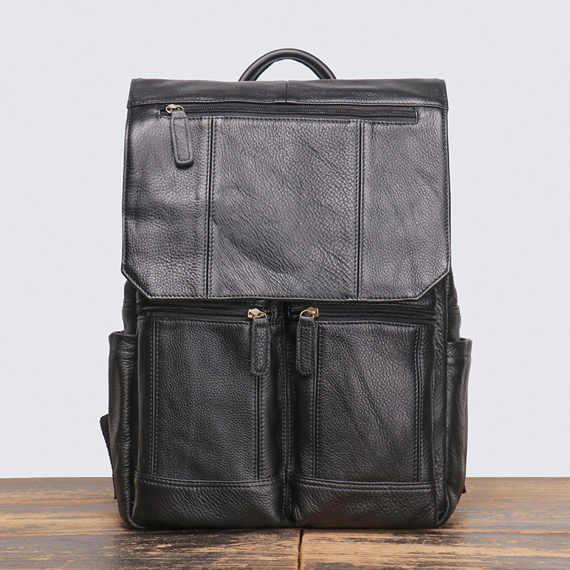 Black distressed leather travel backpack, three-quarter view