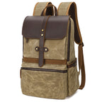 Army green batik waxed canvas backpack with crazy horse leather trim, front view