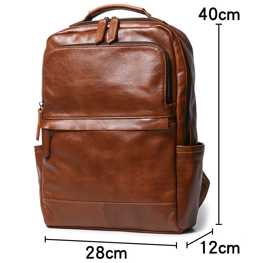 Black leather travel backpack with stitched top handle