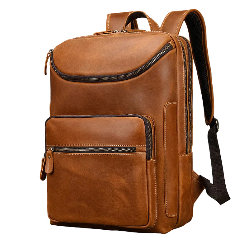 Brown leather backpack on a gray background