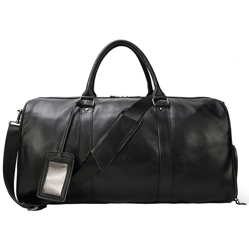 Khal Gold Ambassador weekender in black leather, side view with detachable shoulder strap and luggage tag