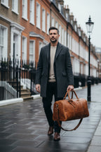 Man carrying the Khal Gold Ambassador tan crazy horse leather weekender on a London street