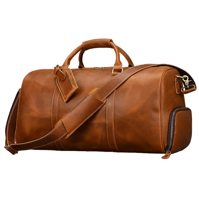 Khal Gold Ambassador weekender in tan crazy horse leather, side view with detachable shoulder strap and external shoe compartment
