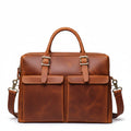 Khal Gold Gresham leather briefcase in tan crazy horse leather, front view with buckle-front pockets and detachable shoulder strap