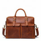 Khal Gold Gresham leather briefcase in tan crazy horse leather, front view with buckle-front pockets and detachable shoulder strap