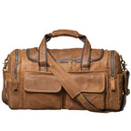 Khal Gold Windsor leather holdall in tan crazy horse leather, front view with buckled end pockets and detachable shoulder strap